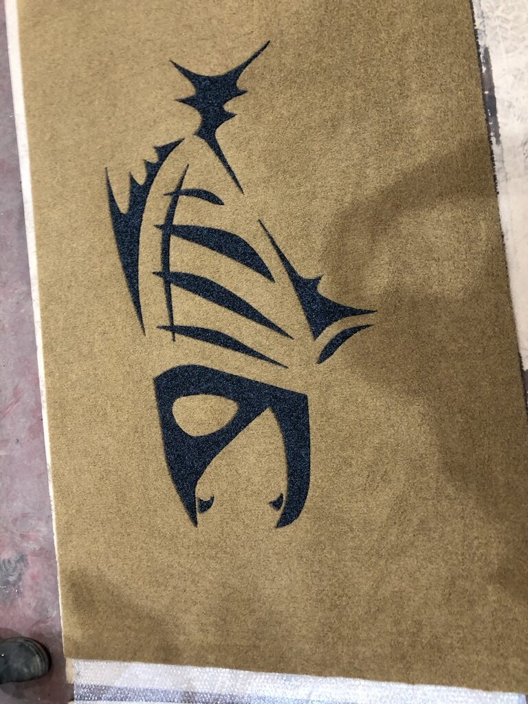 Figure inlaid in carpet