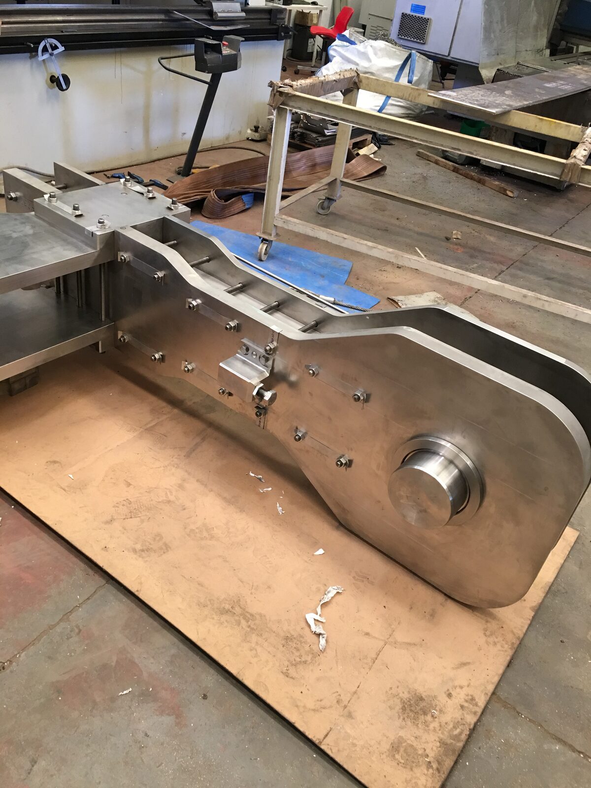 Machined assembly with roller