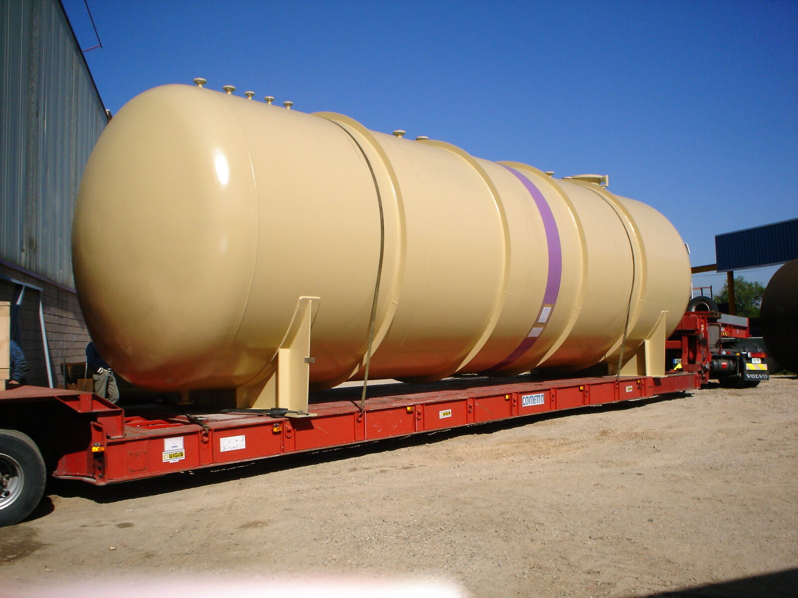 Large tank on lowboy trailer