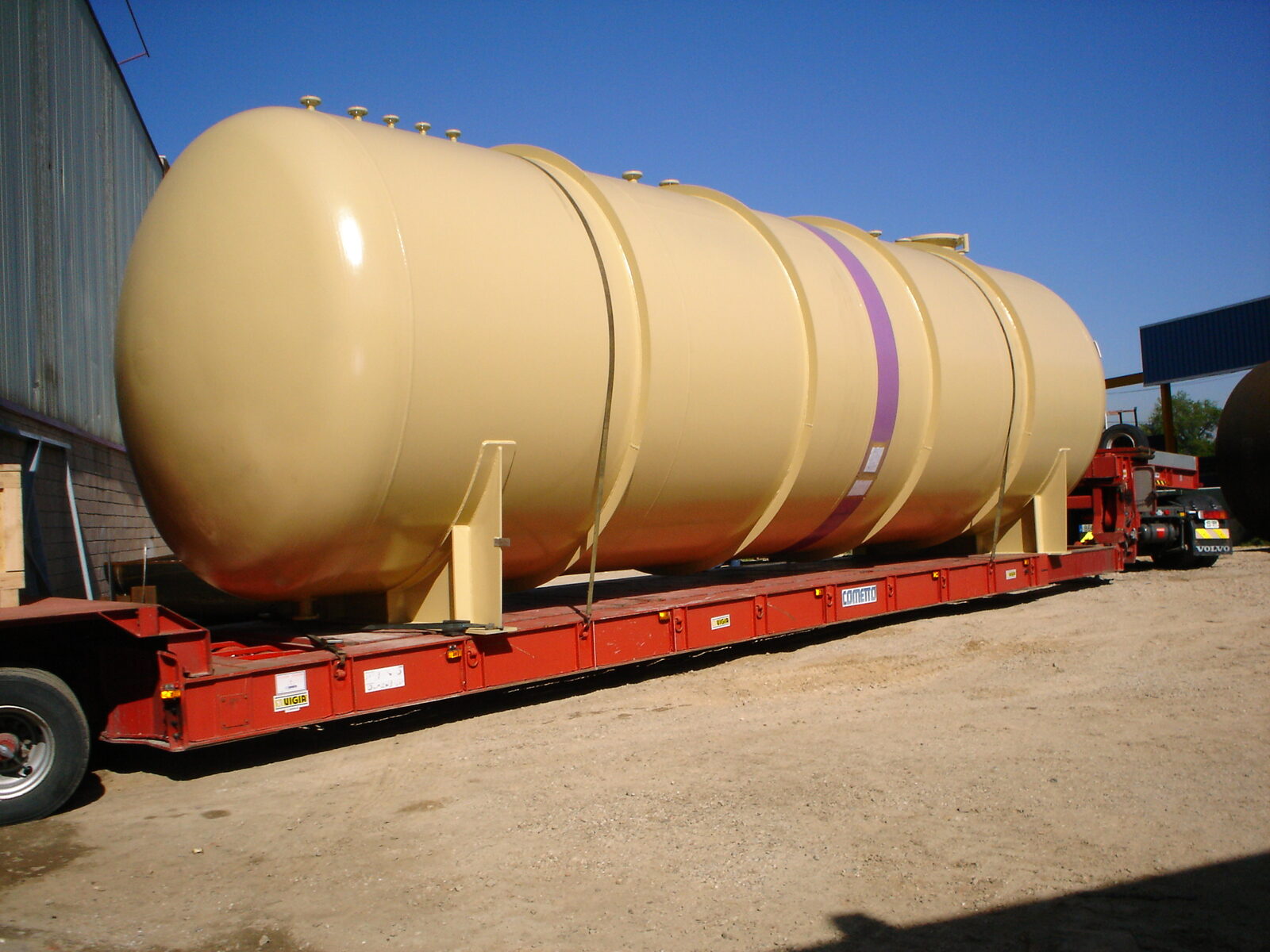 Large tank on lowboy trailer