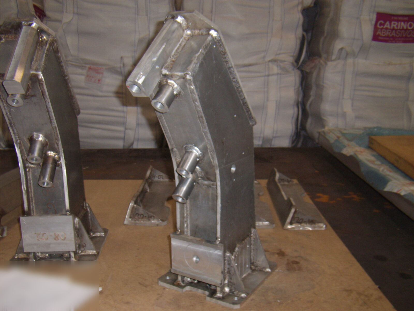 Welded supports with bushings
