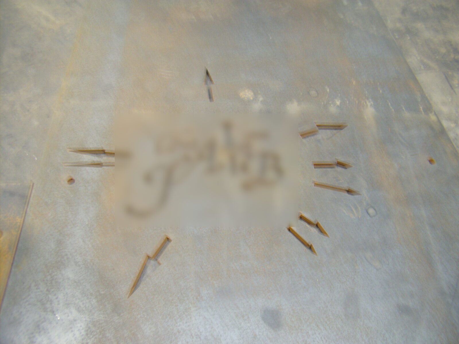 Engraved lettering on sheet metal