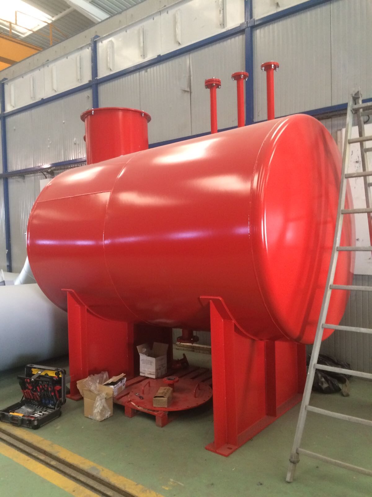 Red tank on supports