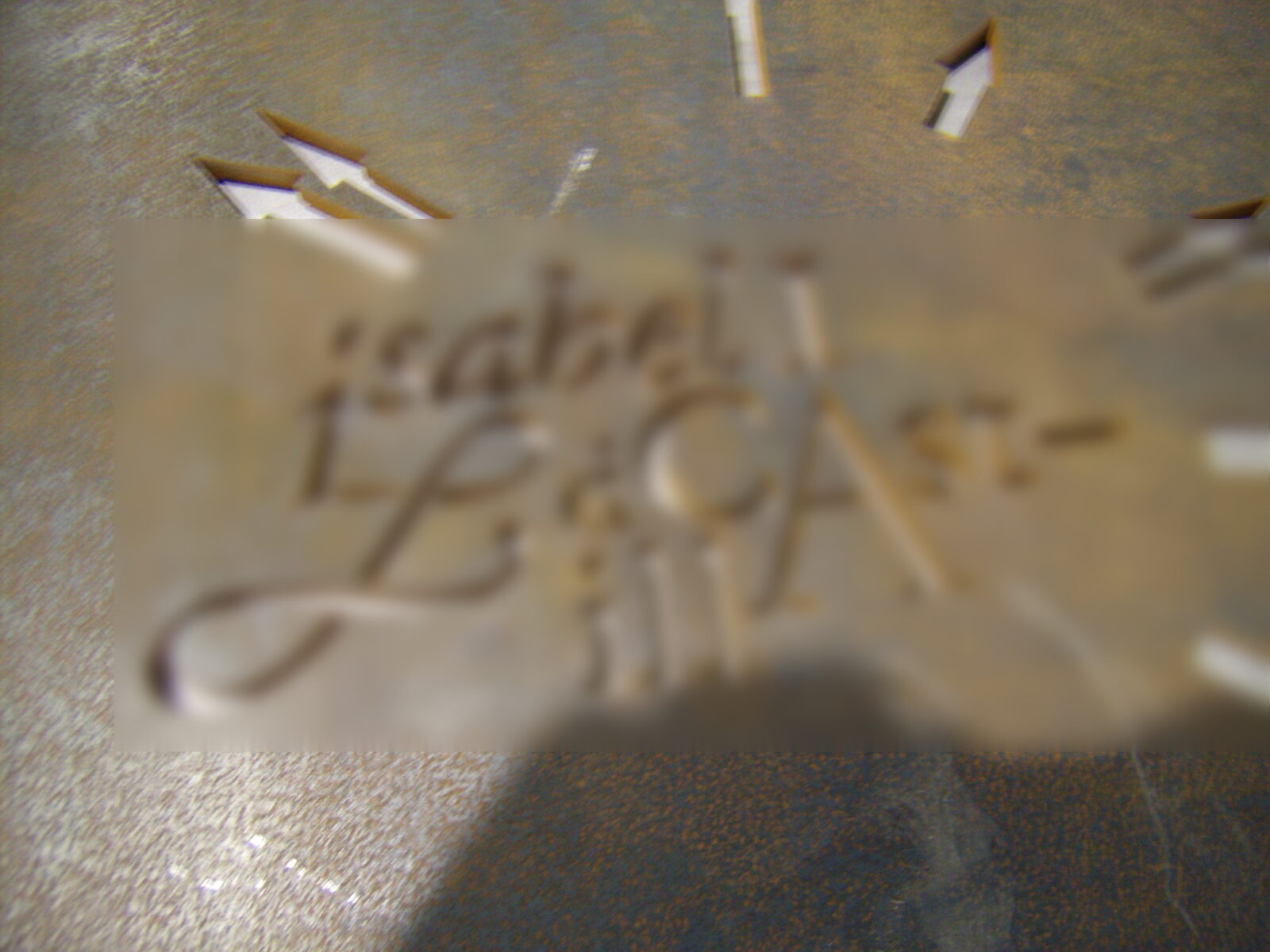 Cut-out letters in rusted sheet