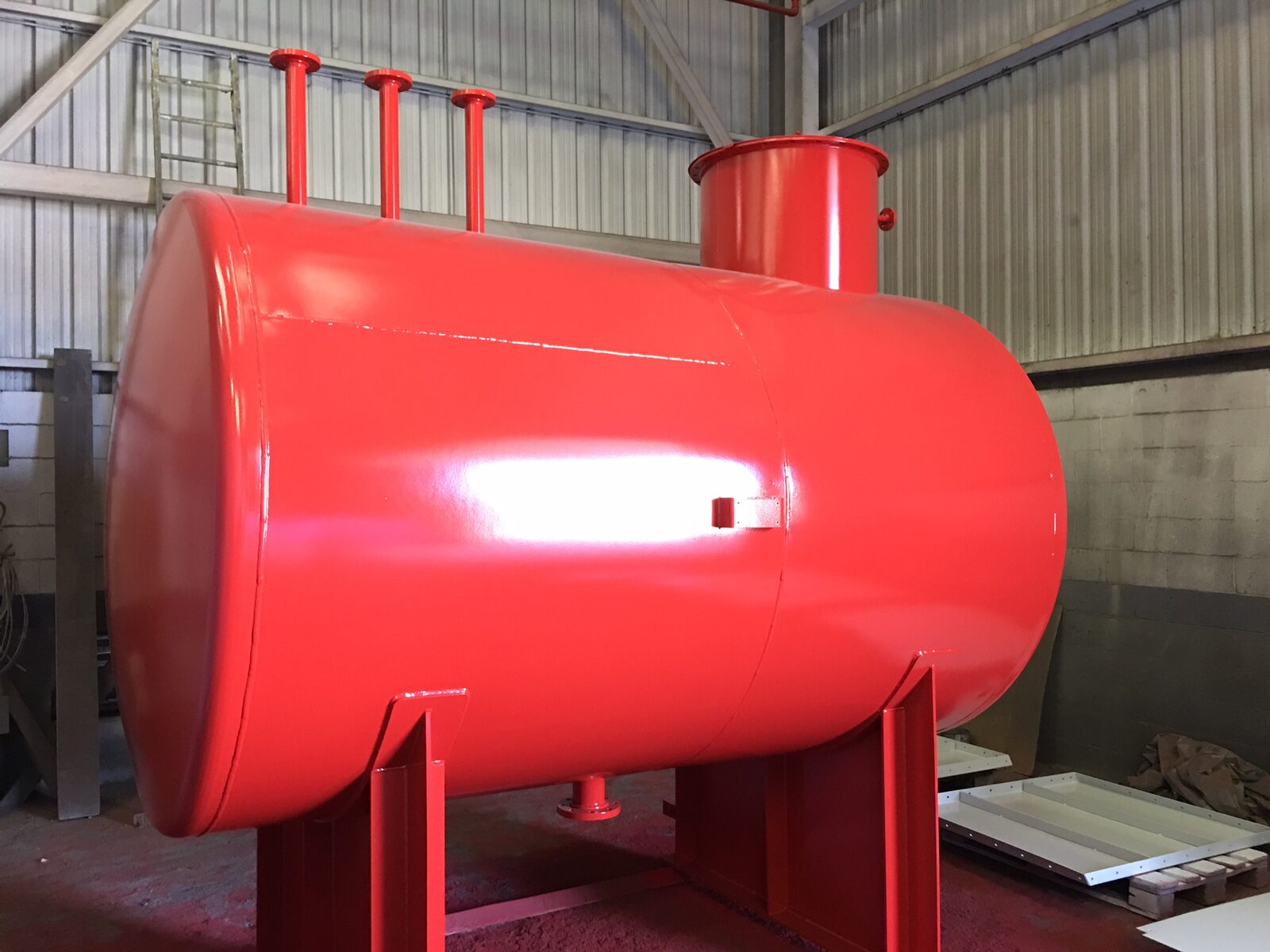 Horizontal tank painted red